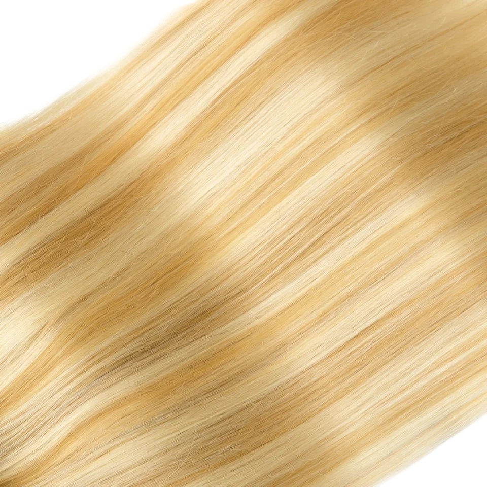 RitzWigs honey blonde straight human hair clip-in extensions with smooth texture and natural highlights.