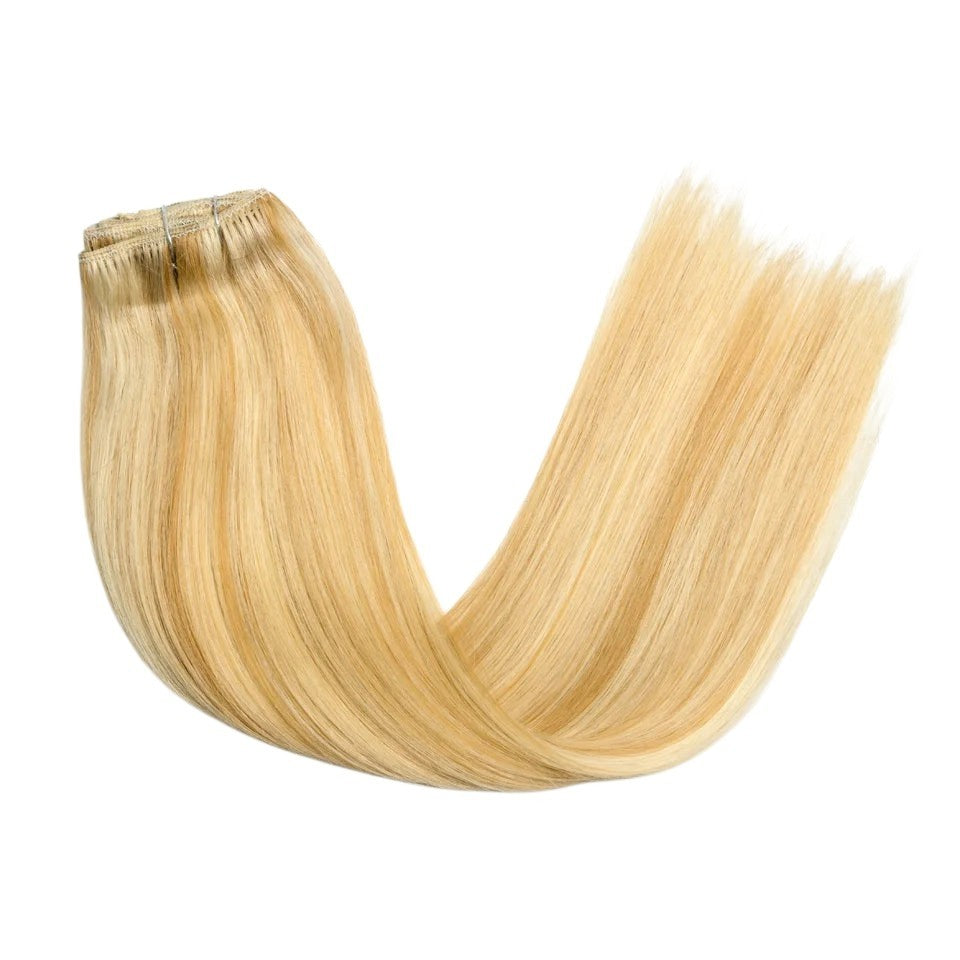RitzWigs honey blonde straight human hair clip-in extensions with a smooth texture and secure weft attachment.
