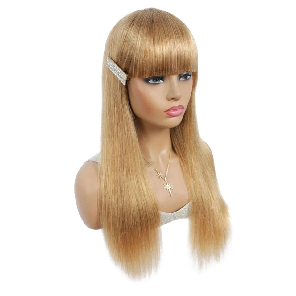 RitzWigs honey blonde straight human hair wig with bangs and a rhinestone hair clip on a mannequin head