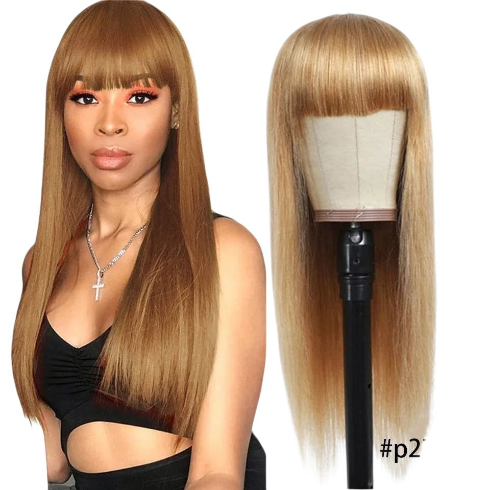 RitzWigs honey blonde straight human hair wig with bangs worn by a model and displayed on a mannequin head