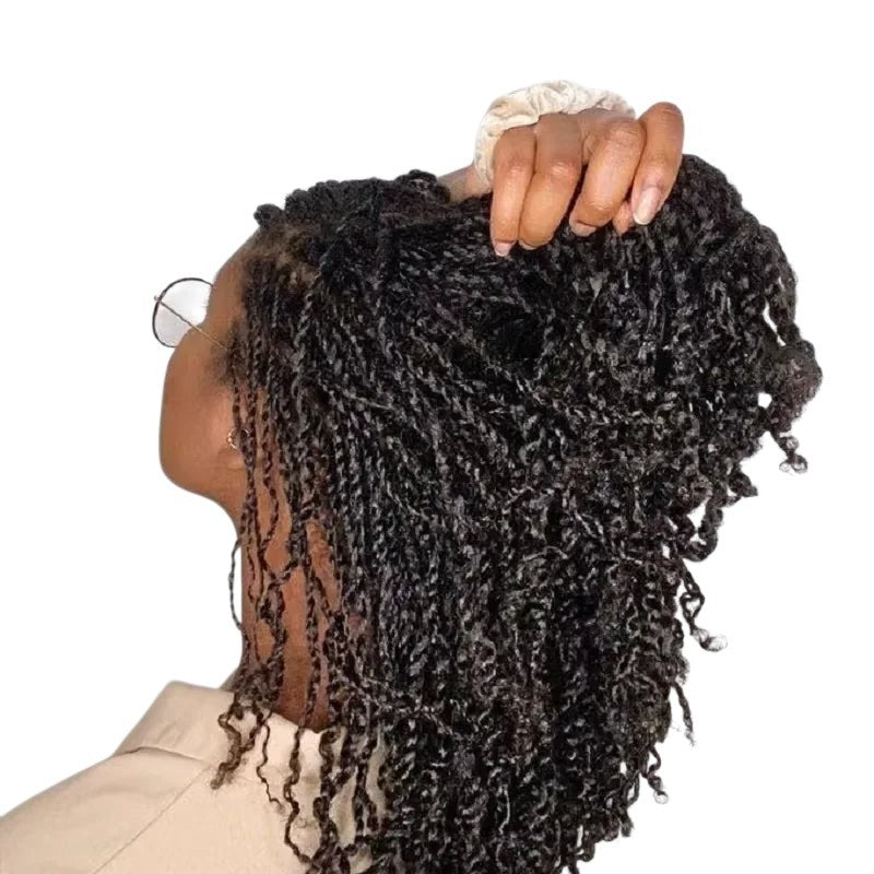 RitzWigs human hair extensions featuring kinky curly texture styled in natural twists on a model