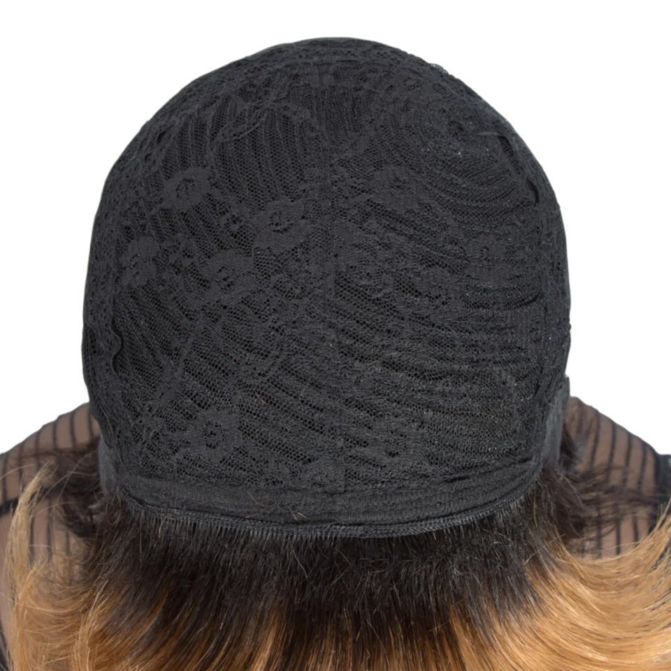 RitzWigs human hair wig interior showing the black lace cap construction with adjustable straps for a secure fit