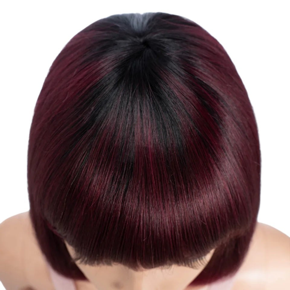 RitzWigs ombre 99J straight bob human hair wig with bangs, featuring dark roots and deep burgundy red tones.