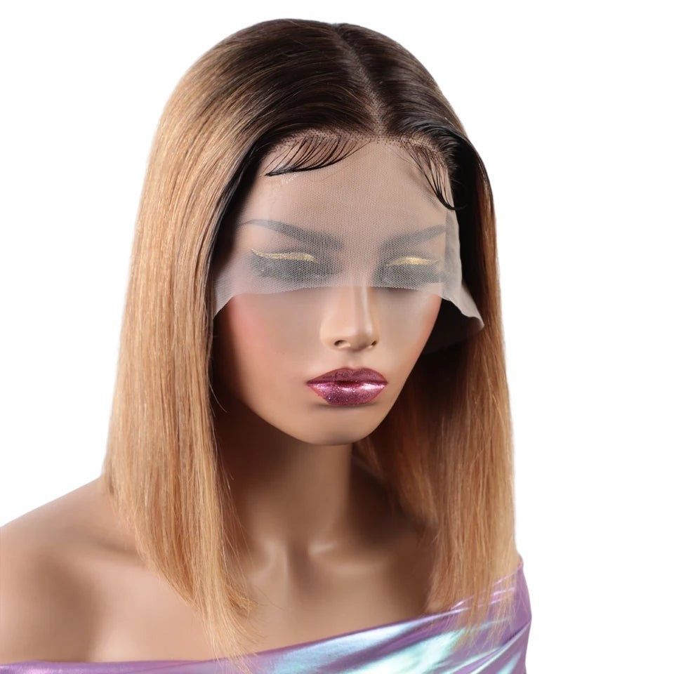 RitzWigs ombre honey blonde highlight bob wig with a blunt cut and transparent lace front on a mannequin head