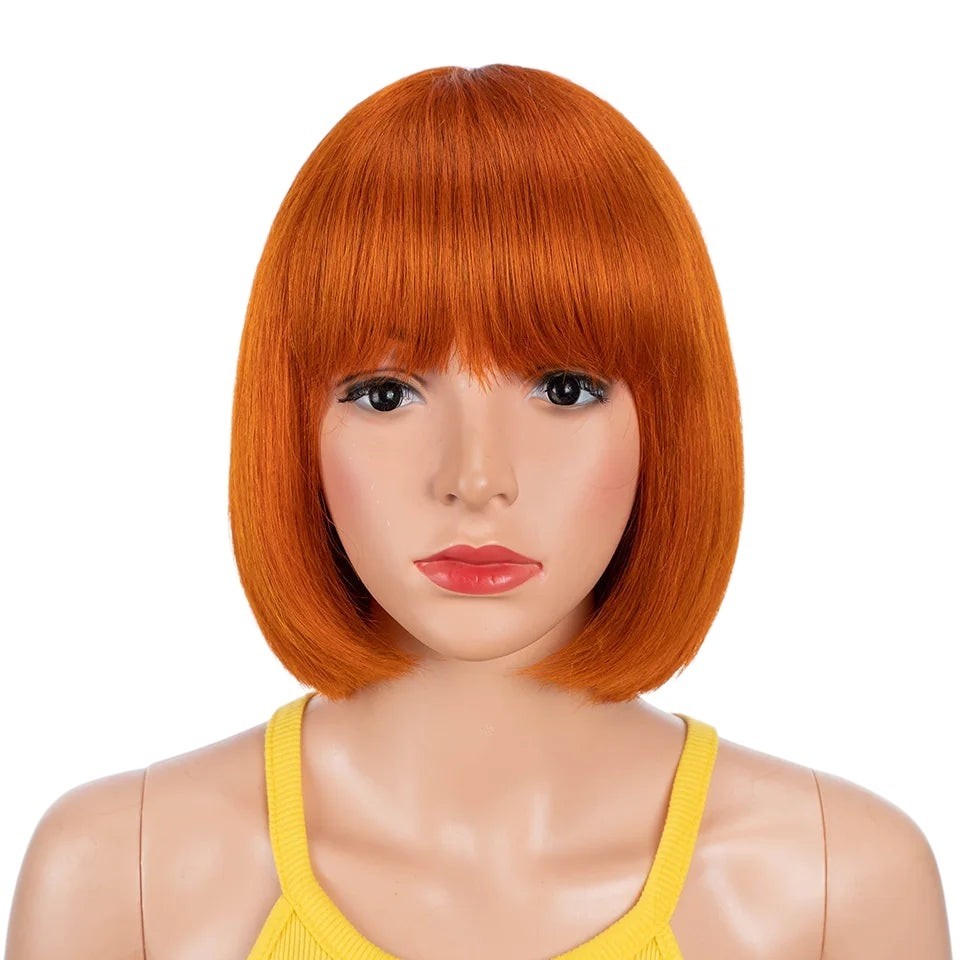 RitzWigs orange ginger straight human hair bob wig with bangs on a mannequin head