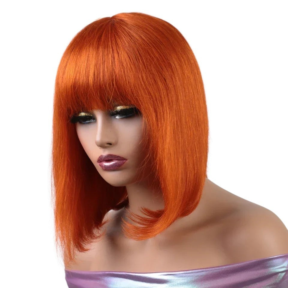RitzWigs short straight orange bob wig with bangs made from Brazilian human hair on a mannequin