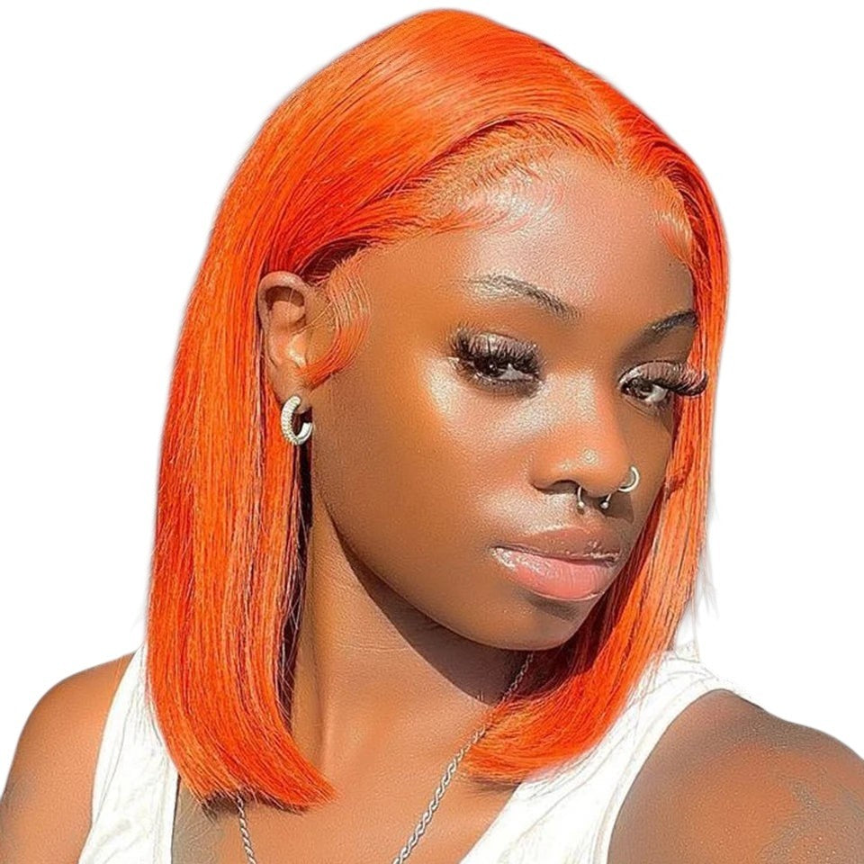 RitzWigs short straight bob wig in vibrant orange human hair with a natural lace front finish on a model