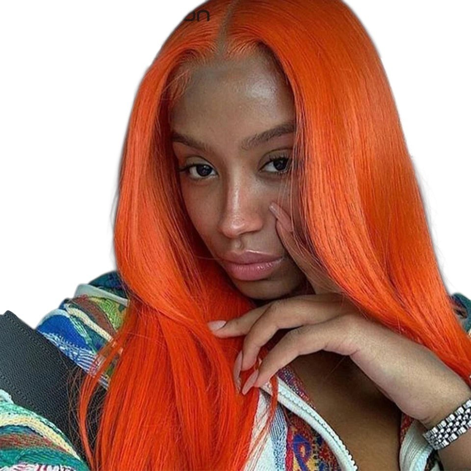 RitzWigs bright orange straight human hair extensions worn by a woman sitting in a car
