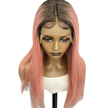 RitzWigs straight pink human hair lace front wig with dark roots and a middle part on a mannequin head
