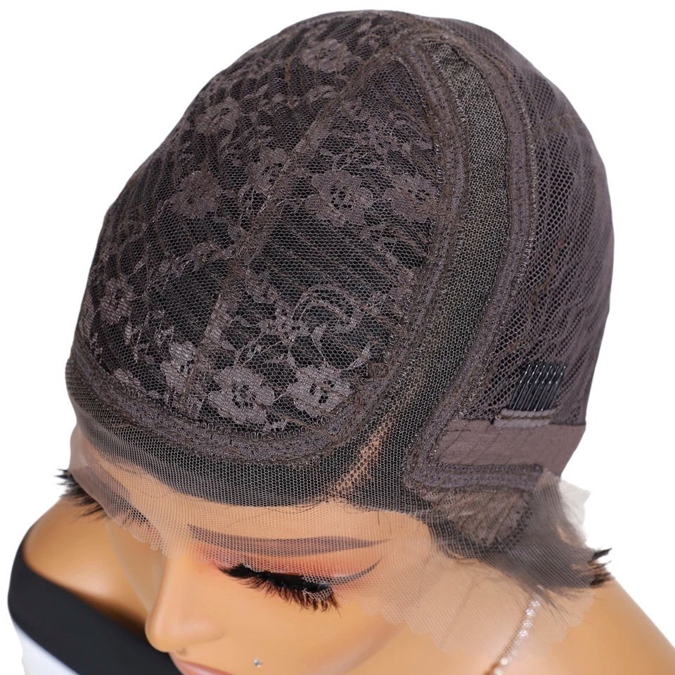 RitzWigs pixie cut lace wig cap interior showing Swiss lace construction and adjustable straps on a mannequin head
