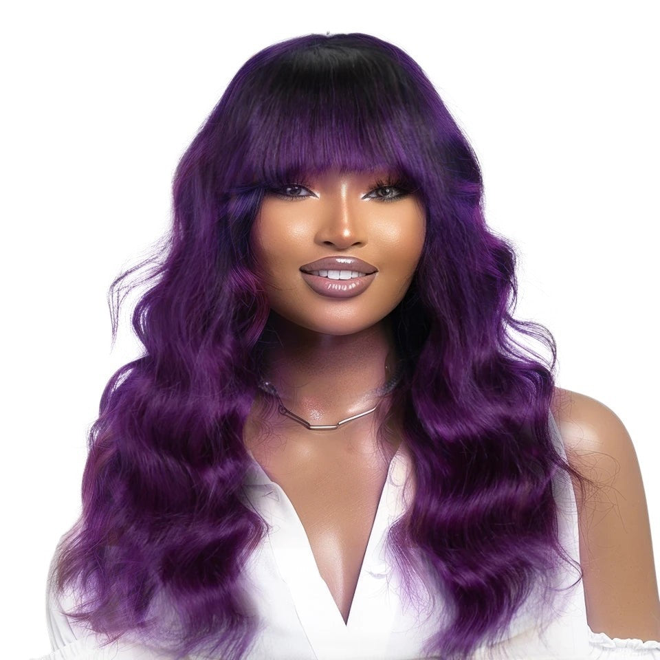 RitzWigs 22-inch T1B purple body wave human hair wig with bangs worn by a model on a white background