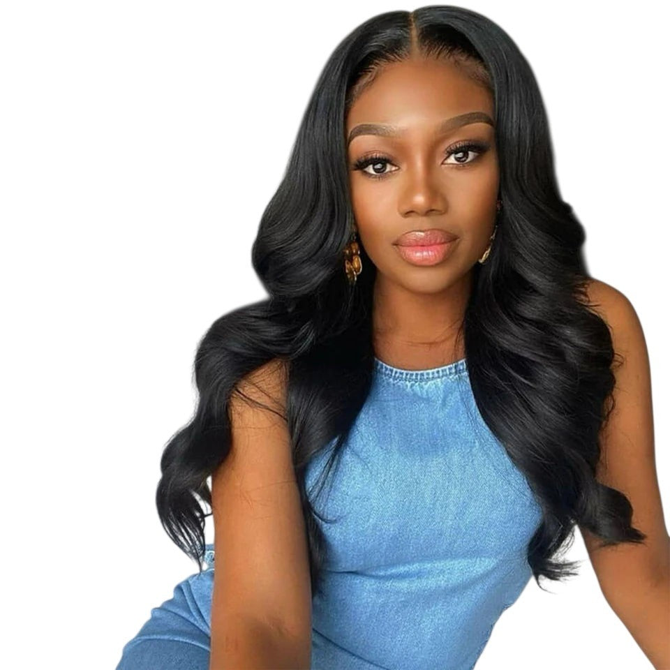RitzWigs Rebecca body wave human hair lace front wig with pre-plucked hairline on a model in a bedroom setting