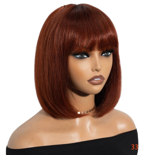 RitzWigs reddish brown Brazilian human hair straight bob wig with bangs on a mannequin head