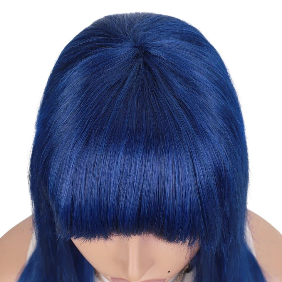 RitzWigs royal blue straight human hair wig with bangs on a mannequin head, top view showing natural part.