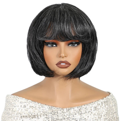 RitzWigs salt and pepper gray short pixie bob human hair wig with bangs on a mannequin
