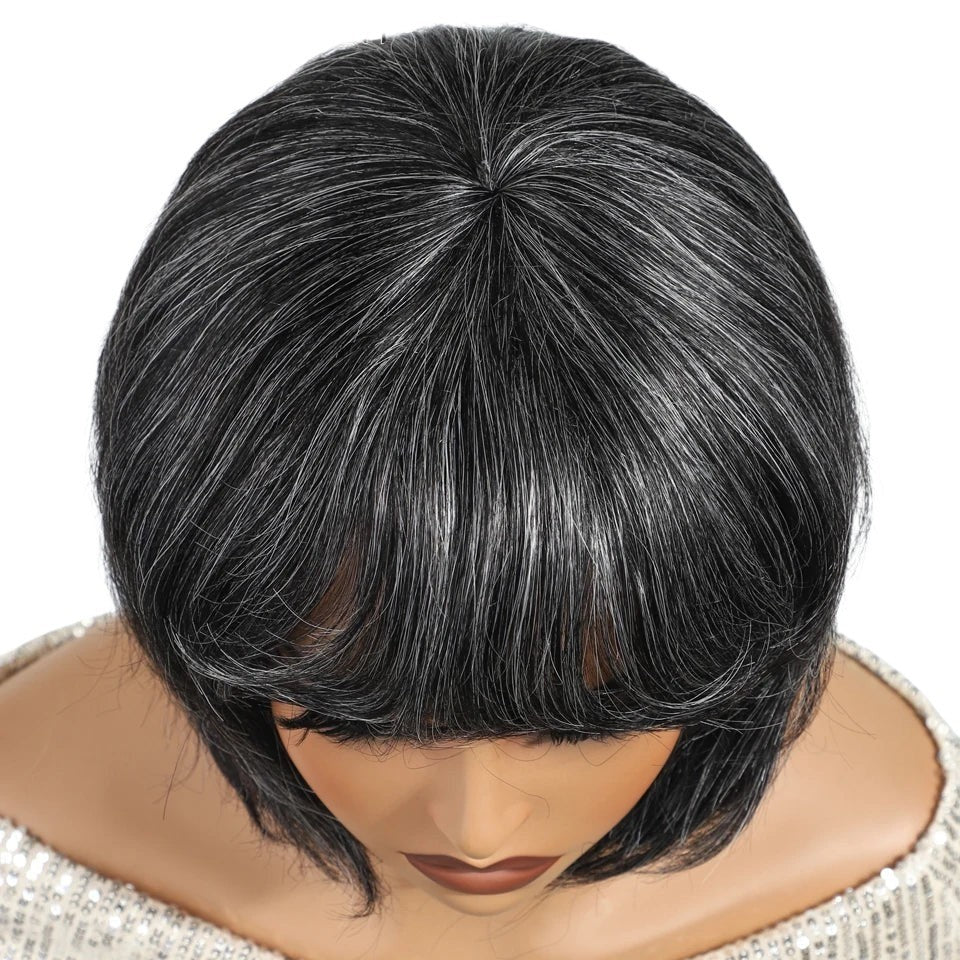 RitzWigs salt and pepper gray short pixie bob human hair wig with natural texture on a mannequin head