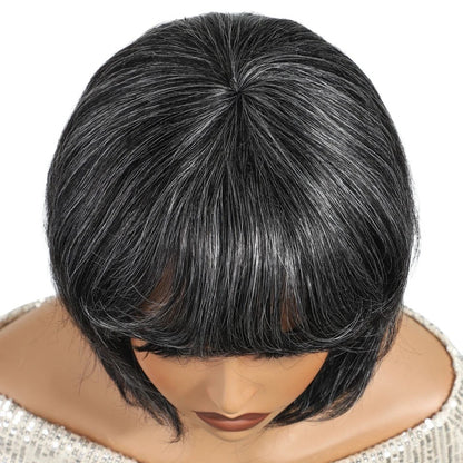 RitzWigs salt and pepper gray short pixie bob human hair wig with natural texture on a mannequin head