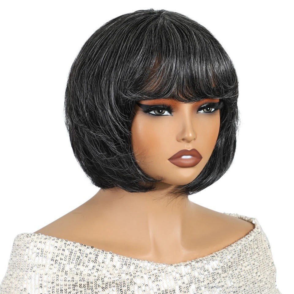 RitzWigs salt and pepper gray short pixie bob human hair wig with bangs on a mannequin