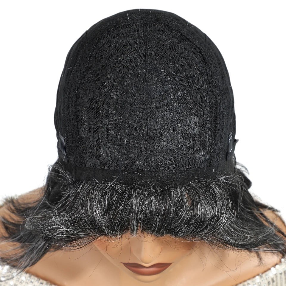 RitzWigs human hair wig cap construction showing black lace interior and salt and pepper gray hair texture
