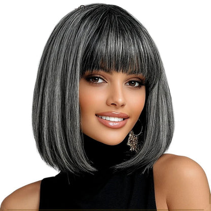 RitzWigs salt and pepper short straight bob wig with bangs on a smiling woman wearing a black turtleneck