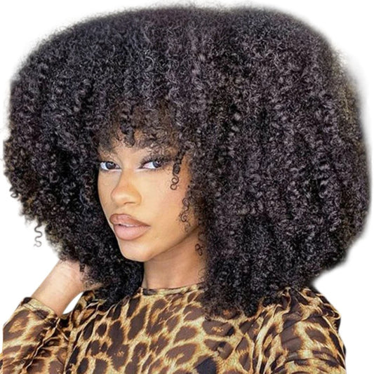 RitzWigs short afro kinky curly human hair wig with bangs on a model wearing a leopard print top