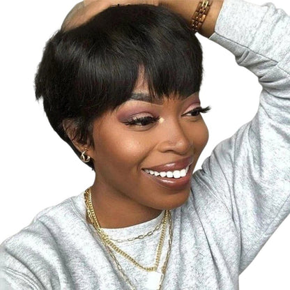 RitzWigs short black pixie cut human hair bob wig with bangs worn by a smiling woman in a grey sweatshirt