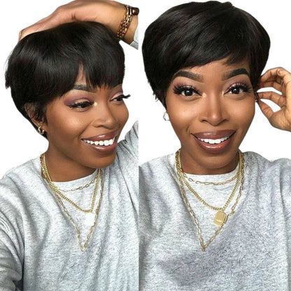 RitzWigs short black pixie cut human hair bob wig with bangs worn by a smiling woman in a grey sweatshirt