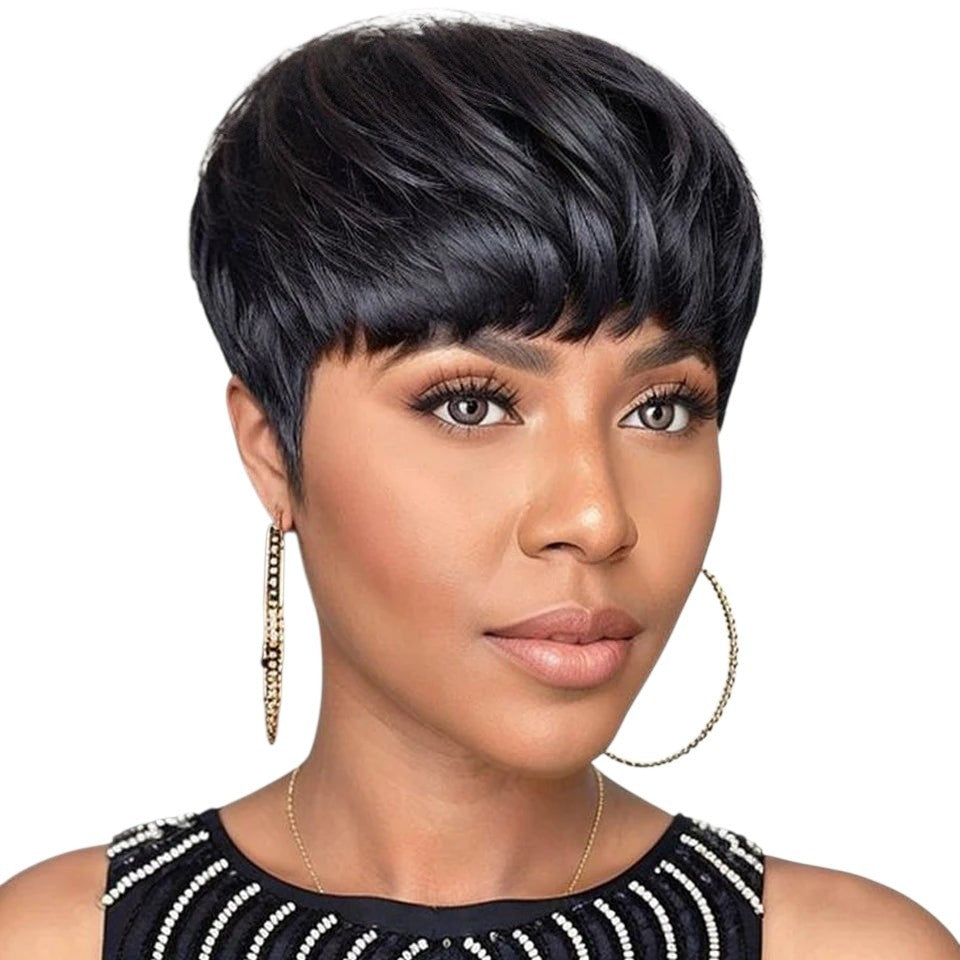 RitzWigs short black pixie cut human hair wig with bangs on a model wearing gold hoop earrings