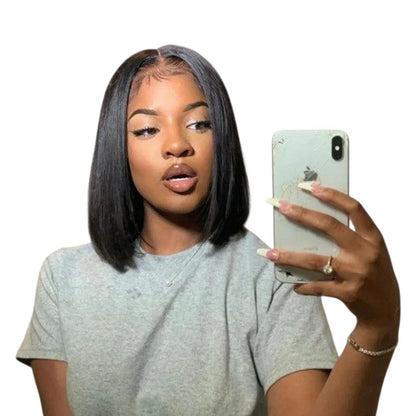 RitzWigs short black straight bob human hair wig with a natural middle part lace front on a woman taking a selfie