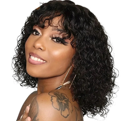 RitzWigs short black curly human hair bob wig with bangs worn by a smiling woman with a shoulder tattoo