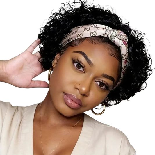 RitzWigs short curly jerry curl human hair headband wig on a woman wearing a patterned headscarf and gold hoop earrings