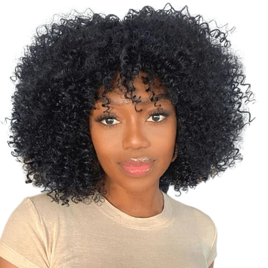 RitzWigs short black afro kinky curly human hair wig with bangs worn by a woman