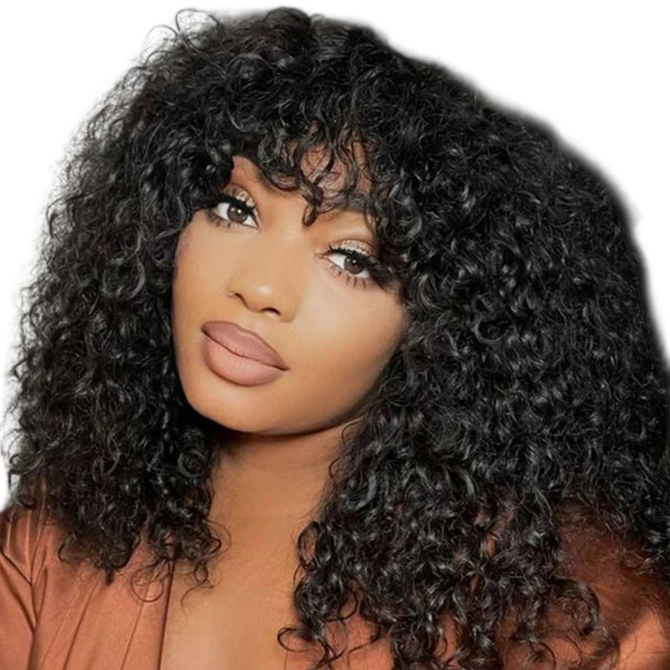 RitzWigs short curly pixie bob human hair wig with bangs in a honey blonde ombre style worn by a woman