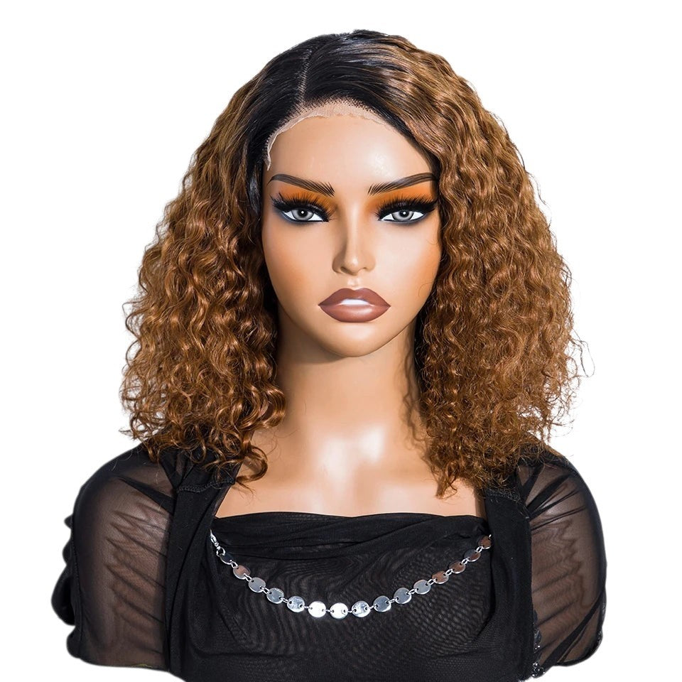 RitzWigs short kinky curly bob wig in a dull cyan and brown blend on a mannequin head with a side part lace front.