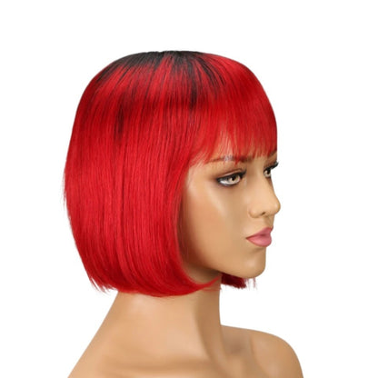 RitzWigs short red straight human hair bob wig with bangs on a mannequin head