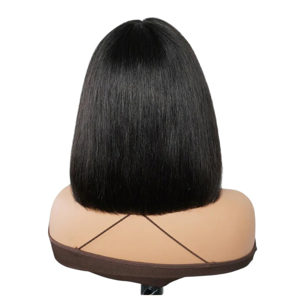 RitzWigs short straight black human hair bob wig with bangs on a mannequin head, back view