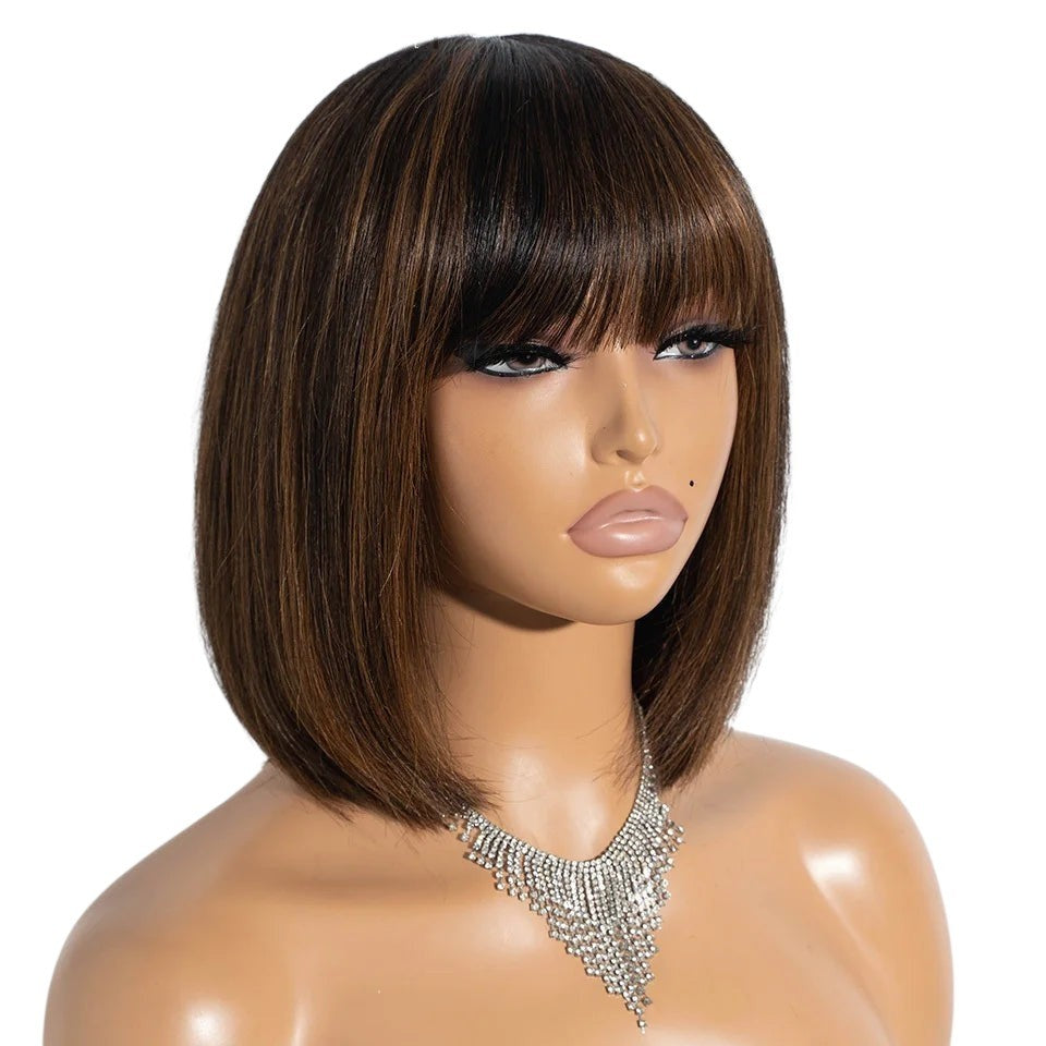 RitzWigs short straight bob human hair wig with bangs and brown highlights on a mannequin