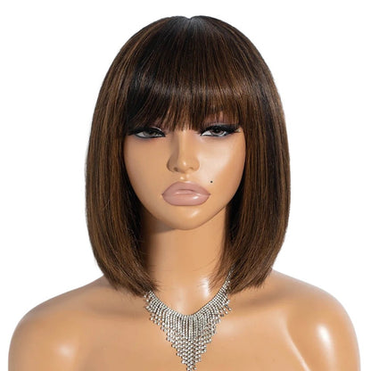 RitzWigs short straight bob human hair wig with bangs and natural highlights on a mannequin head