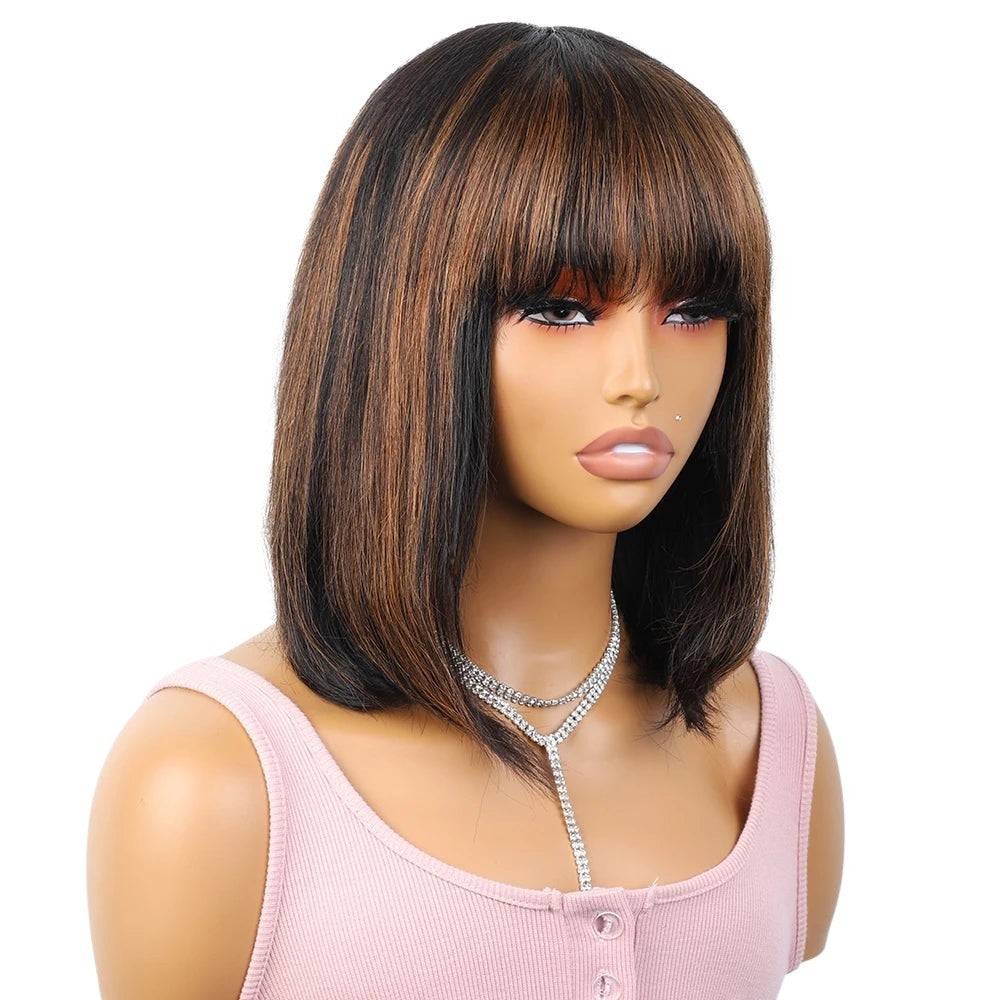 RitzWigs short straight bob human hair wig with bangs and brown highlights on a mannequin