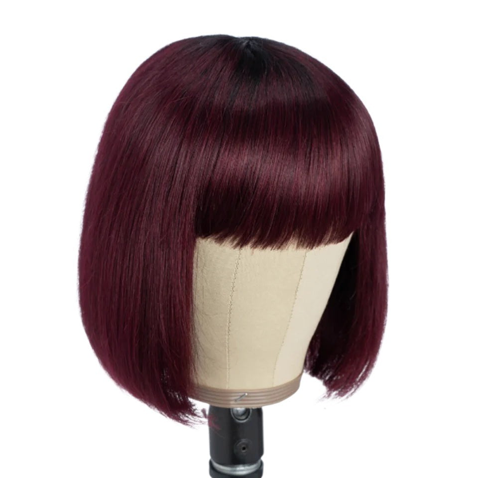RitzWigs short straight bob wig with bangs in a deep burgundy and black mixed colour on a mannequin head