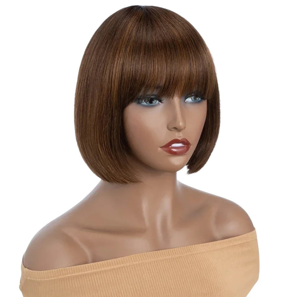 RitzWigs short straight bob human hair wig with bangs in a warm brown tone on a mannequin head