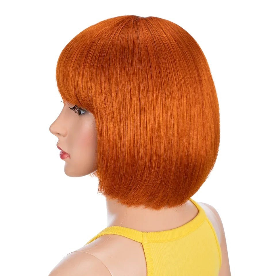 RitzWigs short straight orange bob human hair wig with bangs on a mannequin head, side profile view.