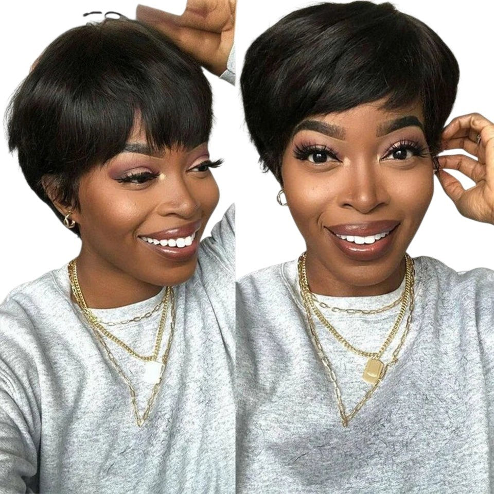 RitzWigs short straight pixie bob wig with bangs on a smiling model wearing a grey sweatshirt and gold necklaces