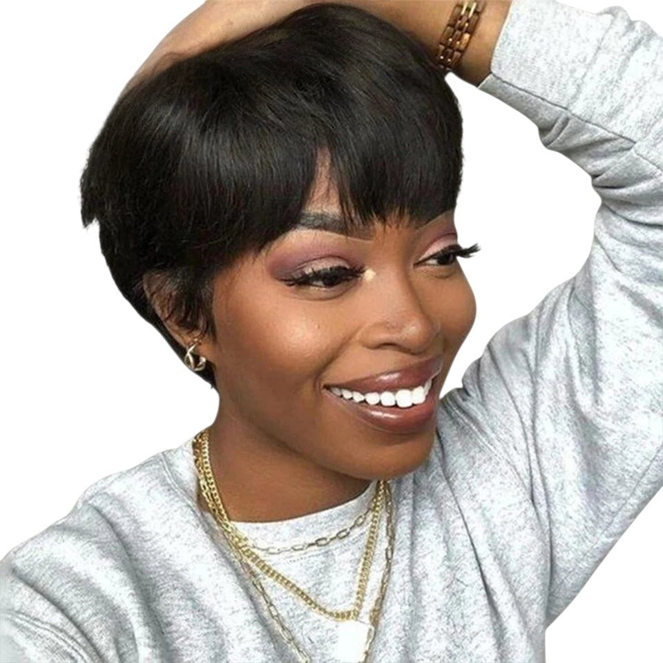 RitzWigs short straight pixie bob wig with bangs on a smiling woman wearing a grey sweater