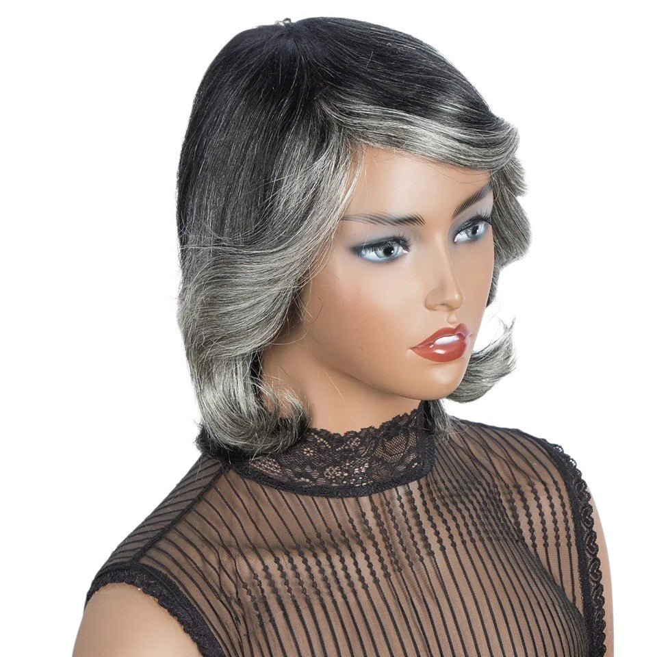 RitzWigs short wavy Brazilian Remy human hair wig in ombre purple, silver, and grey with bangs on a mannequin head.