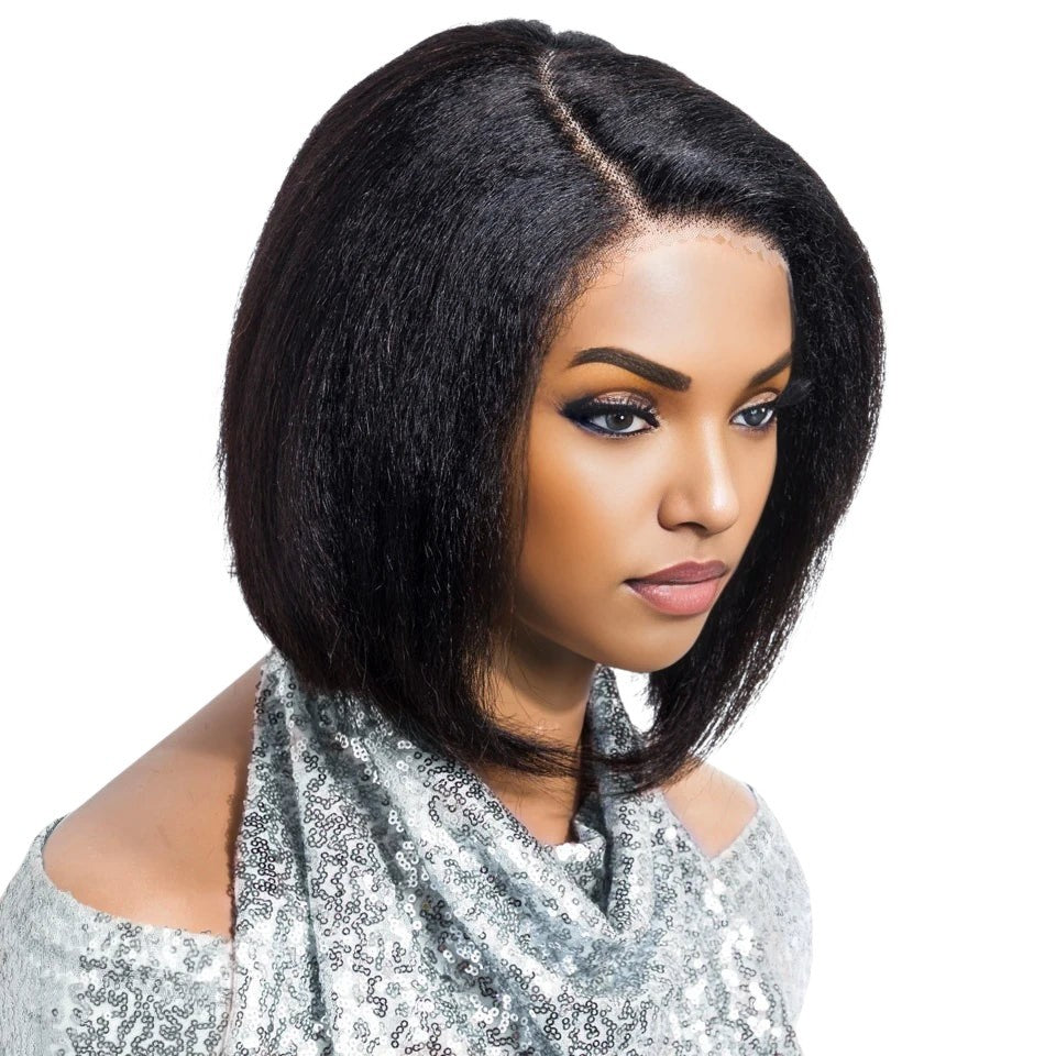 RitzWigs short Yaki straight Brazilian human hair lace wig with a left side part on a model wearing a sequin top.