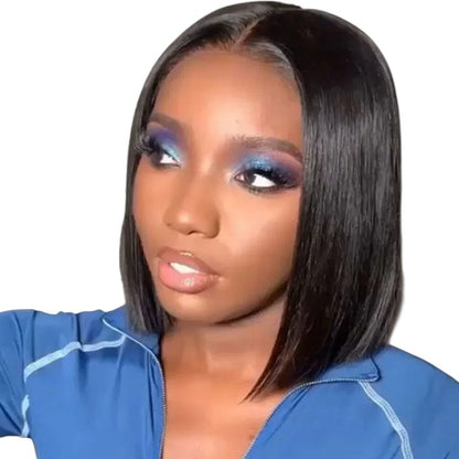 RitzWigs Brazilian straight black bob human hair wig with Swiss lace part on a model with blue eyeshadow