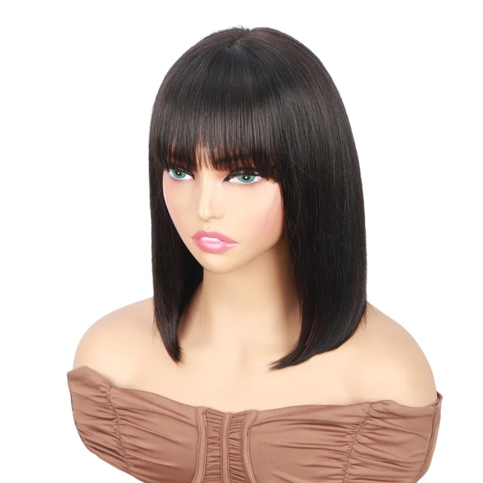 RitzWigs straight black bob human hair wig with bangs on a mannequin head