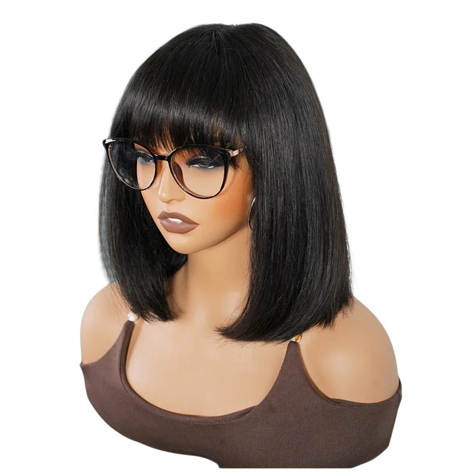 RitzWigs straight black bob human hair wig with bangs on a mannequin wearing glasses