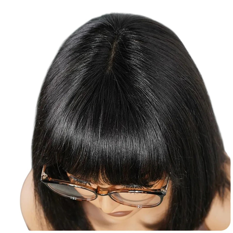 RitzWigs short straight black human hair bob wig with bangs and a realistic middle part lace scalp